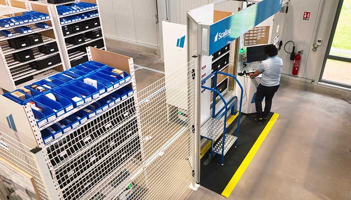 Deployment of the SCALLOG solution: autonomous mobile robots, ergonomic workstations, and robotic shelving